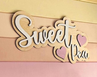 Parent Gives Personalized Wooden Name Sign To Baby For Nursery Decor