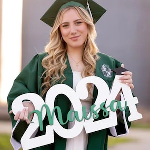 wooden class of 2026 sign used as graduation centerpiece