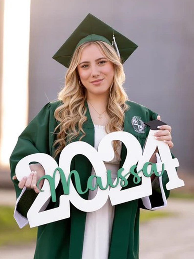 wooden class of 2026 sign used as graduation centerpiece