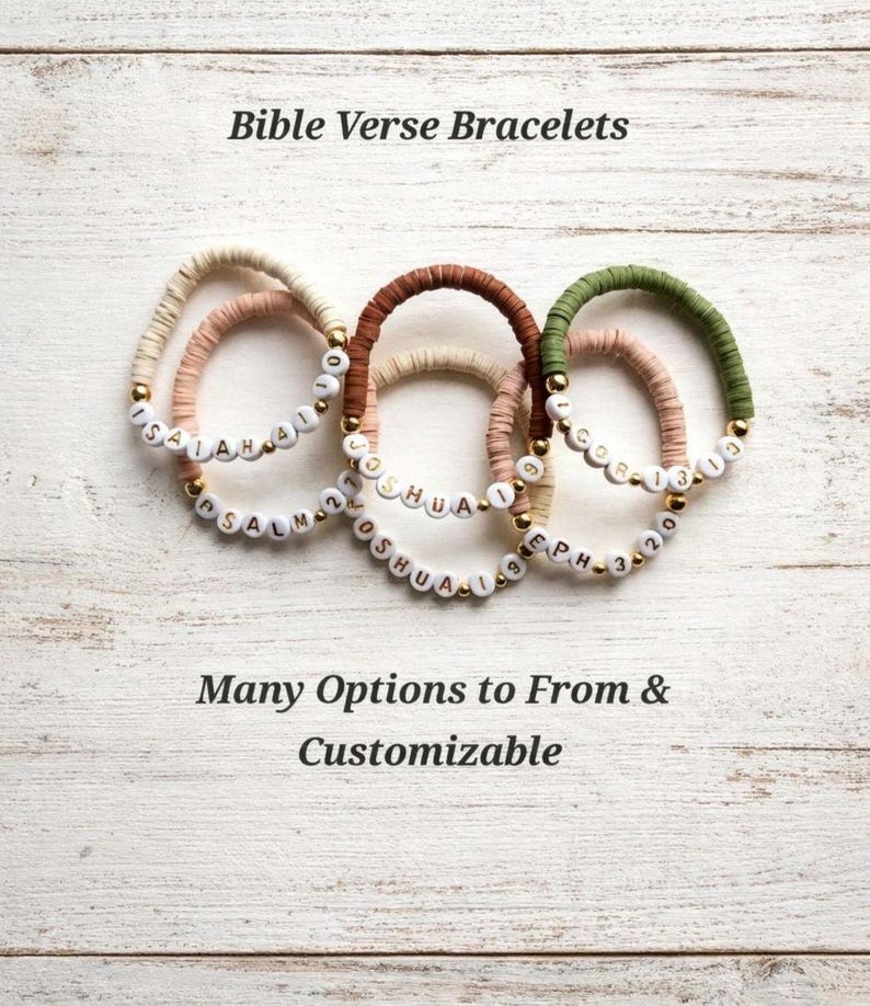 May include: Five circular bracelets made of flat, colored clay beads in shades of cream, tan, brown, and olive green. Each bracelet features white letter beads spelling out Bible verses like Isaiah 41:10, Psalm 27, Joshua 1:9, and Eph 3:20.