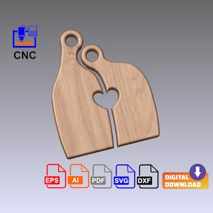 Può includere: Due taglieri di legno a forma di persone, con un cuore tagliato al centro, dove si incastrano. I taglieri sono di colore marrone chiaro.