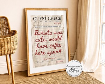 May include: A framed poster featuring a vintage-style guest check design on a wrinkled paper background. The text reads GUEST CHECK, 037594, and in red cursive script, Barista was cute, would have coffee here again, followed by a small red heart.