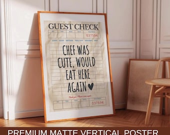 May include: A vertical poster with a vintage guest check design. The text reads "GUEST CHECK" and "CHEF WAS CUTE, WOULD EAT HERE AGAIN". The poster is printed on a textured paper with a brown background and white lines. The poster is framed in a brown wood frame.