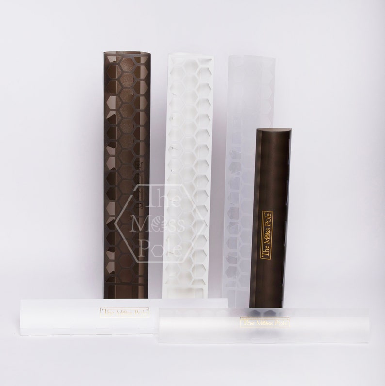 May include: Four different sized clear plastic rolling pins with a honeycomb pattern. The rolling pins have the text "The Messy Pole" printed on them in gold lettering.