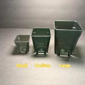 May include: Three dark green square plastic plant pots in small, medium, and large sizes. The pots have a textured design and drainage holes at the bottom. The word "Small", "Medium", and "Large" are written in yellow.