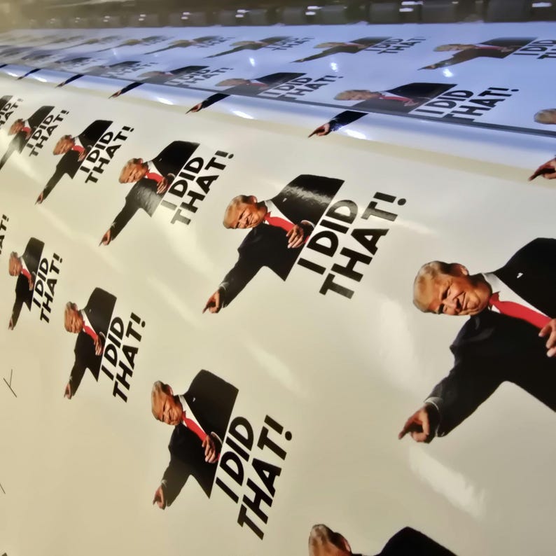 May include: A white background with a repeated pattern of a man in a suit pointing and the text "I DID THAT!" printed in black.