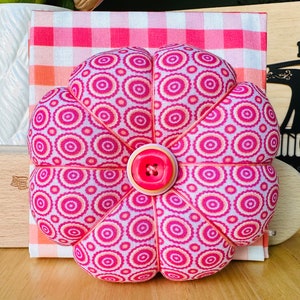 The pinks are photographing overly bright pink.Lovely colors of deep rose, light oranges and peaches.The gingham really sets this one off. Check out the matching embroidery scissor case with rose gold scissor in my shop as well.Great Mom Day gift.
