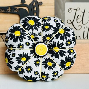 The back of this pincushion is yellow.