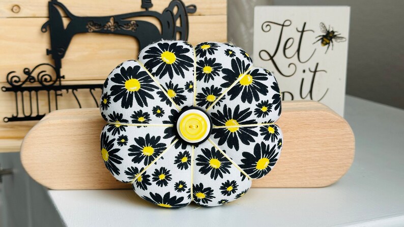 The back of this pincushion is yellow.