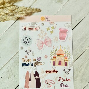 May include: A sticker sheet featuring Islamic-themed designs. It includes a pink bow, a mosque illustration, and phrases such as "Bismillah" and "Trust in Allah's plan." A coffee cup and floral elements are also present. The website address "www.hennabyaleena.com" is displayed.