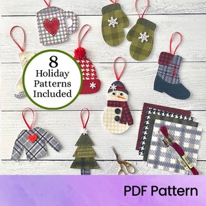 Puede incluir: Ocho patrones de adornos navideños de fieltro, que incluyen un muñeco de nieve, una bota, un guante, una taza, un árbol, un gorro, un suéter y un copo de nieve. Los patrones están impresos en papel blanco con un círculo verde que dice "8 patrones navideños incluidos".