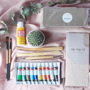 May include: A DIY clay kit with everything you need to get started, including a block of clay, sculpting tools, acrylic paints, a bottle of Mod Podge, and instructions.