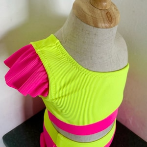 Size XSmall 3t/4 Custom Neon Pink and Neon Yellow with ruffles Ribbed Spandex dancewear, class wear, swimwear, dance convention.