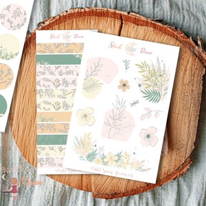 May include: A set of floral themed stickers with pastel colors. The stickers include a variety of floral designs, including leaves, flowers, and branches. The stickers are perfect for adding a touch of whimsy to planners, journals, and other paper crafts.