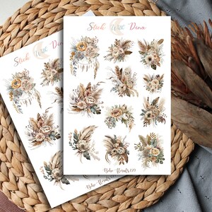 May include: A sheet of stickers featuring 12 different boho floral designs. The stickers are white with a light brown background and feature various flowers, leaves, and feathers. The text "Stick With Dina" and "Boho Florals 01" is printed on the sheet.