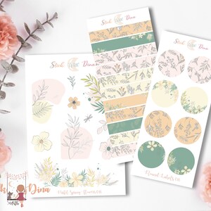 May include: A set of pastel spring floral themed planner stickers with a floral pattern. The set includes a sheet of round labels, a sheet of banner stickers, and a sheet of individual stickers. The stickers feature a variety of floral designs, including leaves, flowers, and butterflies. The stickers are perfect for adding a touch of spring to your planner or journal.