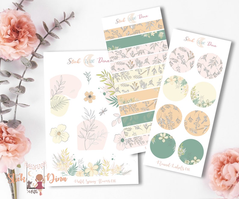 May include: A set of pastel spring floral themed planner stickers with a floral pattern. The set includes a sheet of round labels, a sheet of banner stickers, and a sheet of individual stickers. The stickers feature a variety of floral designs, including leaves, flowers, and butterflies. The stickers are perfect for adding a touch of spring to your planner or journal.