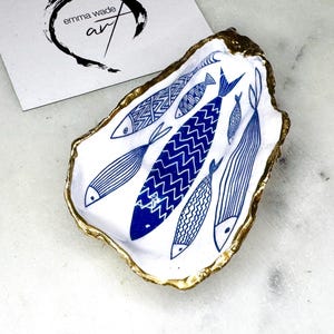 Blue Fish Gift, Trinket Oyster Shell dish gold finish, gold leaf trinket tray, shell oyster dish, personalised oyster shell trinket, decorative oyster shells, Fish Design key bowl, blue and gold dishes, fish ring dish, golden trinket dish, bride shell dish, shell jewellery bowl, decoupaged earrings dish, shell art trinket, art dish, Gold shell trinket holder, painted shell with gold, shell jewellery dish, Emma Wade art, Proposal Ring Tray, Painted Key Bowl, Bride shell Dish