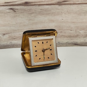 1970’s Travel alarm clock in leather case