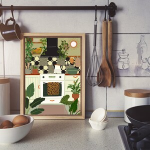 May include: A framed illustration of a kitchen with white cabinets, a black and white tiled backsplash, and a white oven with a leopard print tea towel hanging on the door. The kitchen is decorated with plants and a sun-shaped mirror.