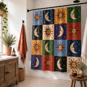 May include: A shower curtain featuring a grid pattern of alternating sun and moon illustrations. The design includes various celestial faces in shades of yellow, orange, red, blue, green, and black, accented with small stars against solid color backgrounds.