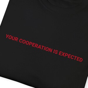 Your Cooperation is Expected T-shirt, Dystopian Unisex Tee, Casual Style, Gift for Friends, Streetwear, Trendy Apparel, Self-Expression