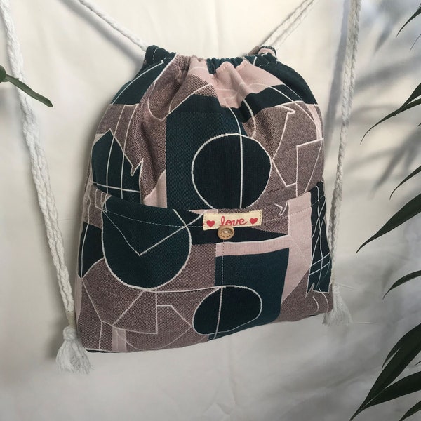 Washable fabric backpack adjustable straps, pocket plated geometric fabric