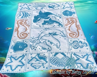 May include: A white and blue crochet blanket featuring a mosaic pattern of marine life including dolphins, seahorses, starfish, and seashells. The blanket displays a grid of squares with detailed aquatic motifs and includes the text "dO Crochet Mosaic by Betsy Sickler" in the bottom right corner.