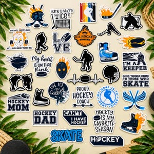 May include: A collection of ice hockey themed stickers featuring various designs including hockey players, skates, pucks, goalie masks, and text such as Hockey Mom, Hockey Dad, I'm a Keeper, and Hockey is My Favorite Season.