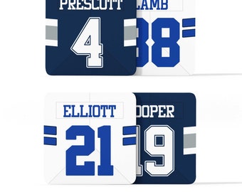 May include: Four white and blue jersey squares with player names and numbers. The top left square says "PRESCOTT 4", the top right square says "LAMB 88", the bottom left square says "ELLIOTT 21", and the bottom right square says "COOPER 19".