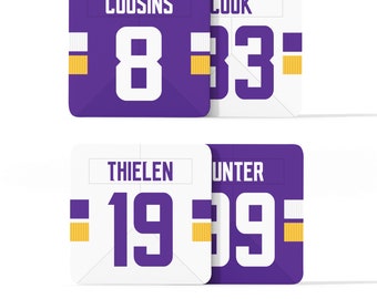 May include: Four purple and white jersey squares with player names and numbers. The top row reads "COUSINS 8" and "COOK 33". The bottom row reads "THIELEN 19" and "HUNTER 19".