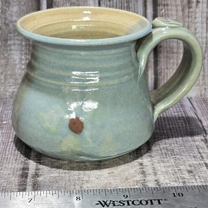 Handmade Studio Pottery Mug | Sage Green Ochre Two-Tone Glaze, Floral Detail, Thumb Rest