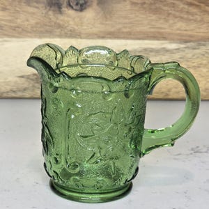vintage Green Glass Creamer// mini pitcher with Floral design glows