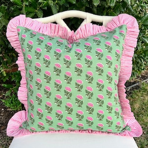 Green and pink block print pillow cover with striped ruffle trim