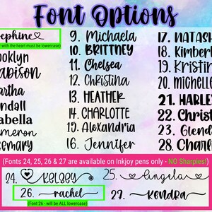 May include: A list of 29 font options for names, with a heart symbol next to some of the names. The text "Font Options" is at the top of the image. The text "(Fonts 24, 25, 26 & 27 are available on Inkjoy pens only - NO Sharpies!)" is below the list of names. The text "(Font 26 - will be ALL lowercase)" is below the last name on the list.