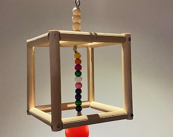 Brinquedo de madeira para pássaros: balanço em cubo com contas e bola