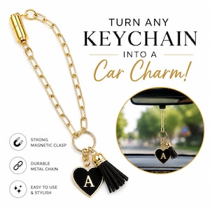 May include: A gold-toned metal chain with a magnetic clasp, featuring a black heart-shaped charm with the letter A and a black tassel. Text reads: TURN ANY KEYCHAIN INTO A Car Charm! STRONG MAGNETIC CLASP, DURABLE METAL CHAIN, EASY TO USE & STYLISH.