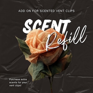 May include: A white text graphic on a black background with a rose image. The text reads "SCENT Refill" and "ADD ON FOR SCENTED VENT CLIPS".  The text also reads "Purchase extra scents for your vent clips!"