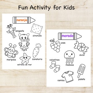 May include: A printable coloring page with black and white illustrations of various objects, including a lobster, a tiger, a butterfly, a starfish, a pillow, a carrot, grapes, a candy, a jellyfish, socks, a shirt, and a popsicle. The page is divided into two sections, each with a crayon at the top, one labeled "naranja" and the other labeled "morado".