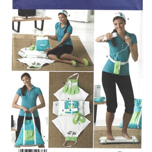 May include: Simplicity pattern 2438, featuring a woman demonstrating a fitness accessory set. The set includes a mat, gloves, a headband, and a carrying bag. The pattern is labeled "One Size" and includes the Simplicity logo.