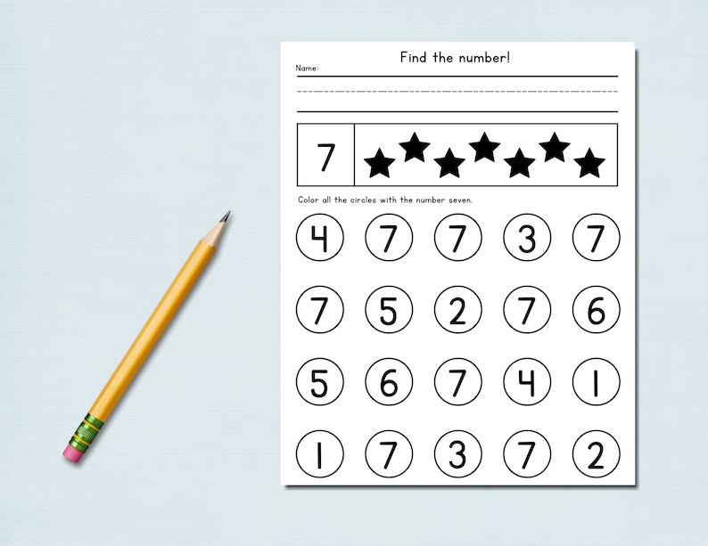 May include: A worksheet with the title "Find the number!" features a number seven and stars, with circles containing numbers. A yellow pencil with a pink eraser lies on the left. The task is to color the circles with the number seven.