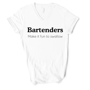 May include: White V-neck t-shirt with the text "Bartenders Make it fun to swallow" in black. The shirt is made of a soft material and is suitable for casual wear. The text is centered on the front of the shirt.