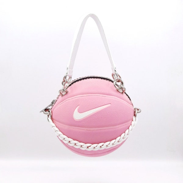 Rosa-weiße Nike Skills-Basketballtasche mit Griffen aus echtem Leder.