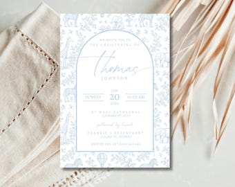May include: A light blue and white christening invitation with a safari animal pattern. The invitation includes the name "Thomas Johnson", date, time, and location details. The design features giraffes, zebras, and elephants.