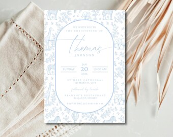 May include: A light blue christening invitation with a safari animal and floral design. The invitation includes the name "Thomas Johnson", date, time, and location details. The invitation is surrounded by a light blue border and safari animal illustrations.