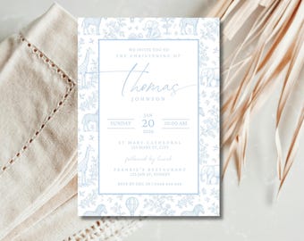 May include: A light blue christening invitation with a safari animal pattern border. The invitation features the name "Thomas Johnson" in elegant script, along with the date, time, and location details. The design includes zebras, giraffes, and elephants.