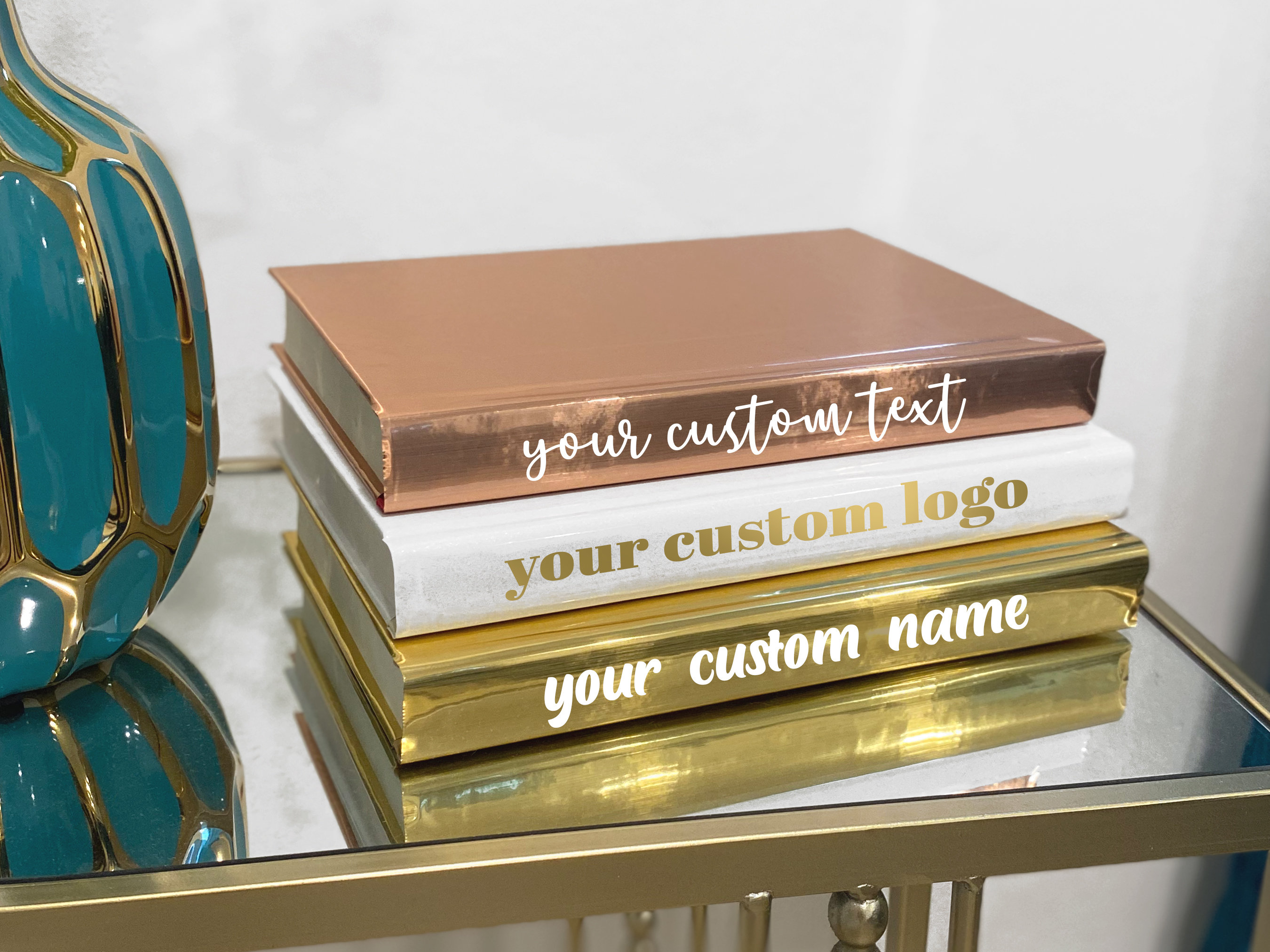 Kyss Studio - Glam your bookshelf or coffee table with luxury designer books.  Stack them up in classic style or choose the color that will take your room  to new heights of