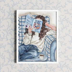 May include: Watercolor print of a person reading a book titled "And Now, Back to You" while seated in a blue plaid armchair. The person is wearing a white sweater and blue jeans. A cup of coffee sits nearby.