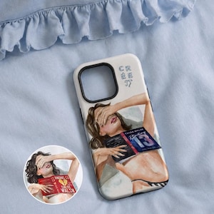 May include: A white smartphone case featuring an illustration of a person lying down with their hand over their eyes while holding a book titled Binding 13 by Chloe Walsh. The case includes the text C R E E with a small bow icon near the camera cutout.