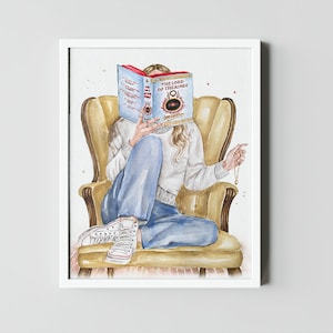 May include: A watercolor illustration of a person sitting in a yellow armchair, reading a book titled "The Lord of the Rings". The person is wearing blue jeans, a white sweater, and white sneakers. They are holding a gold chain with a pendant.